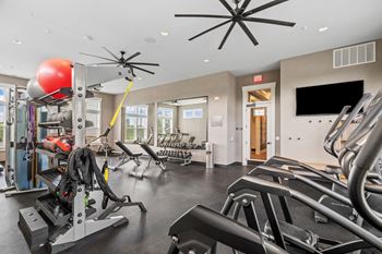 24/7 Fitness center with cardio and weight training